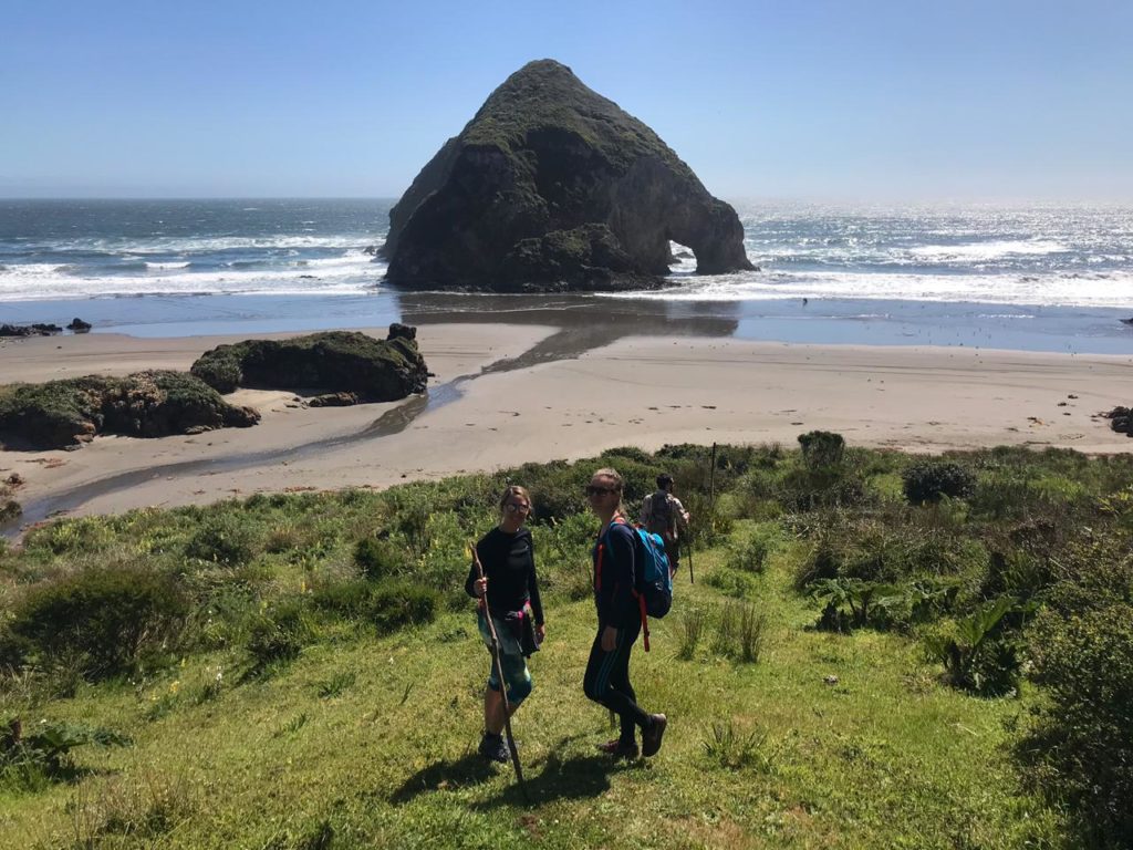 Hikers on Chiloe beach in Chile